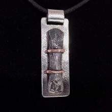 Silver, iron and copper pendant