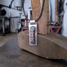 Silver, iron and copper pendant