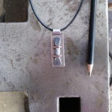 Silver, iron and copper pendant
