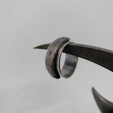 Silver ring with iron and copper detail