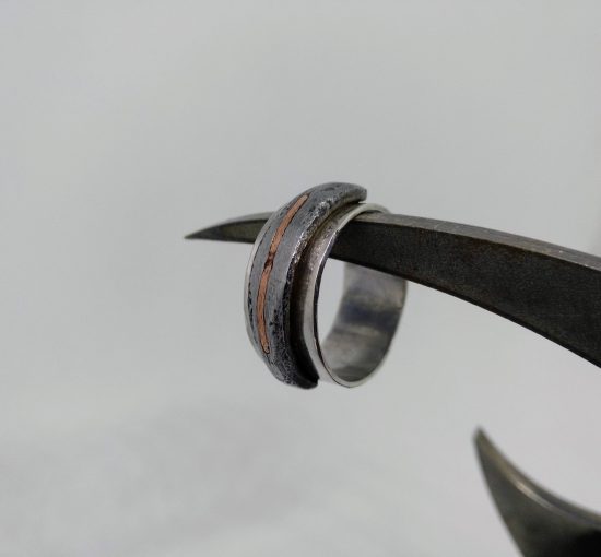 Silver ring with iron and copper detail