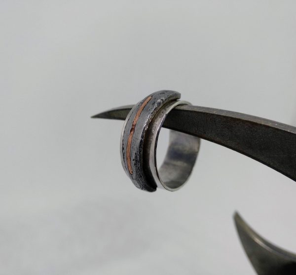 Silver ring with iron and copper detail