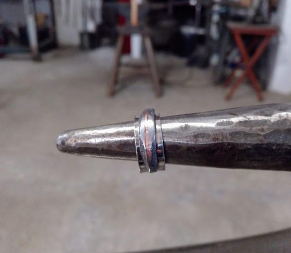 Silver ring with iron and copper detail