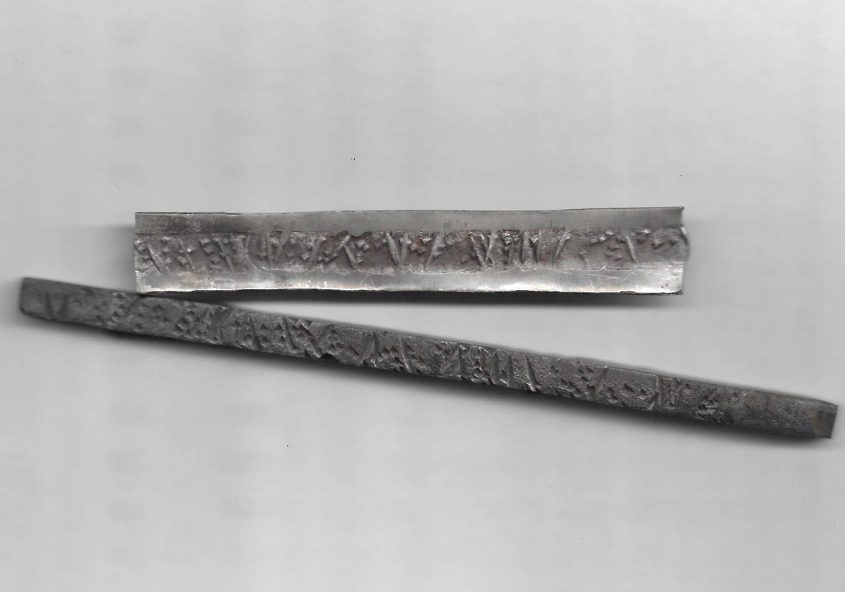 silver piece with steel die