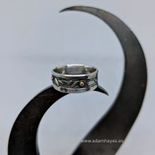 Silver ring with pattern stamp and copper dots Silver ring with pattern stamp and copper dots