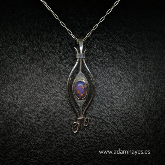 Forged and textured silver pendant set with Purple Turquoise
