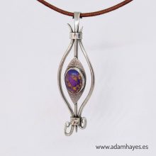 Forged and textured silver pendant set with Purple Turquoise