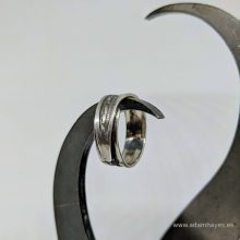 Silver ring with textured overlap Silver ring with textured overlap