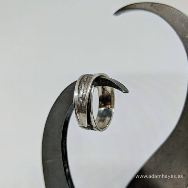 Silver ring with textured overlap Silver ring with textured overlap